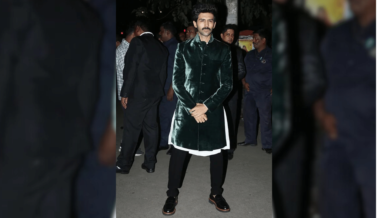 Handsome In Green: Actor Kartik Aryan looked dashing in this velvet green sherwani set paired with black pants. What uplifts his look is his confident look and amazing charm. (Photo Courtesy: Pinterest)