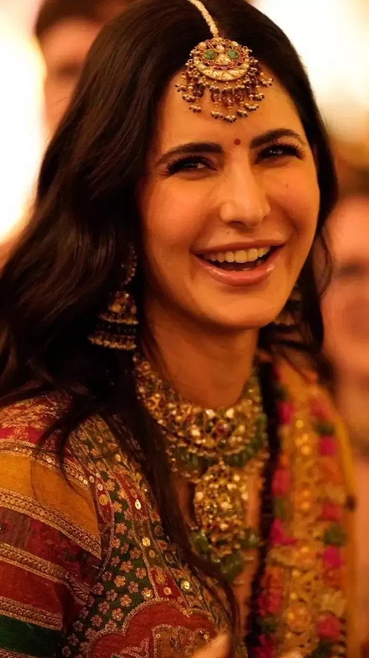 During her wedding function, Katrina was seen wearing her designer Sabyasachi lehenga with a multicoloured mang tika that elevated the whole look.