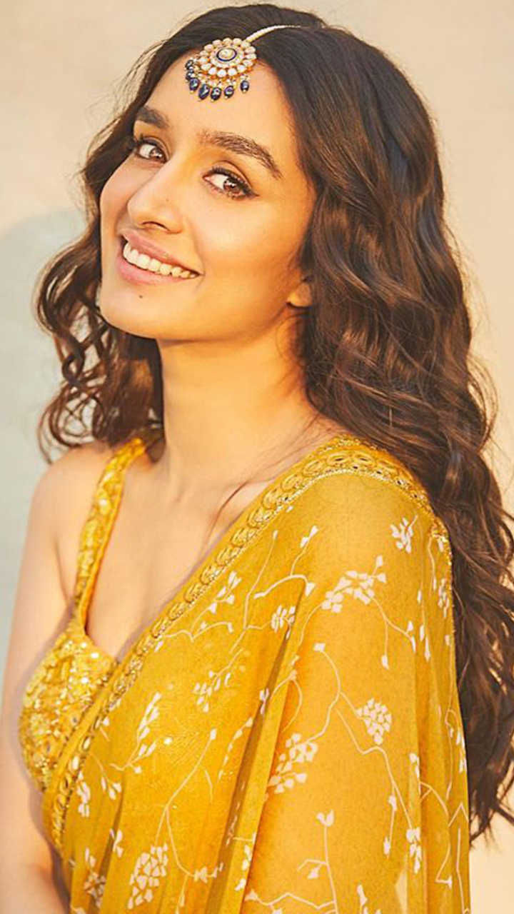 Actress Shradha Kapoor set the internet  on fire in this yellow embroidered lehenga, complementing the look is a subtle green mang tika and her radiant smile.