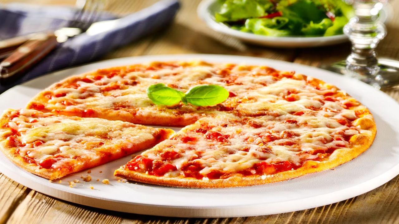 Margherita Pizza: Margherita pizza is a classic Italian dish that is loved by people worldwide. It is made with pizza dough, mozzarella cheese, tomato sauce, basil leaves, olive oil, and salt. (Picture credit: bofrost).