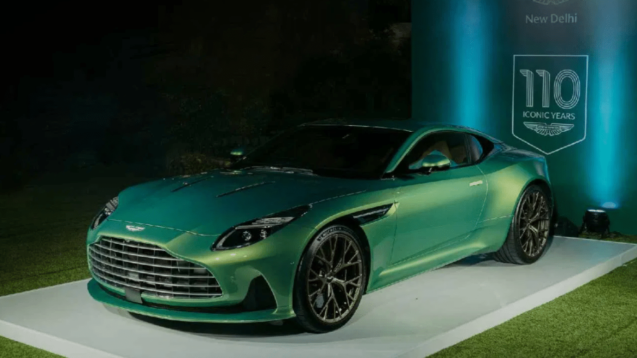  Interior: The interior features of the Aston Martin DB12 include 10.25-inch touchscreen infotainment system, electronic stability control, ABS with EBD, wireless phone charging, 11-speaker sound system and more. 